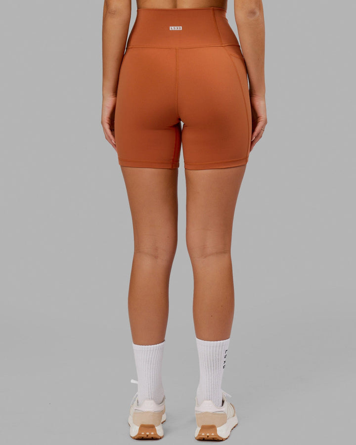 Model wearing Fusion Mid Short Tight - Auburn