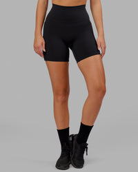 Woman wearing O.G. Fusion Ultra High-Rise 6" Short Pockets - Black | Model:Milly | Size:S