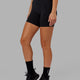 Woman wearing Fusion Mid Short Tight - Black