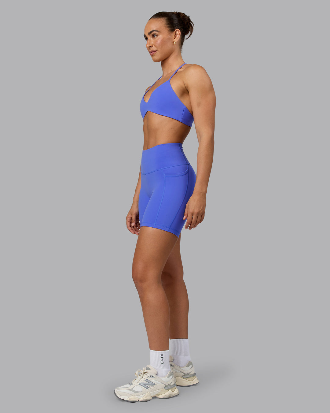 Woman wearing Fusion Ultra High-Rise 6&quot; Short Pockets - Baja Blue | Model:Sophie | Size:S