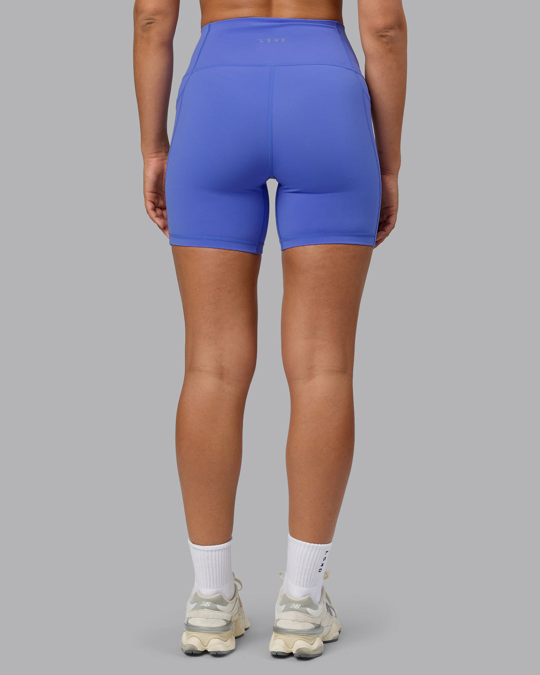 Woman wearing Fusion Ultra High-Rise 6&quot; Short Pockets - Baja Blue | Model:Sophie | Size:S