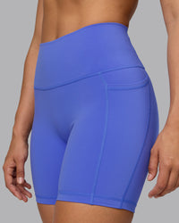 Woman wearing Fusion Ultra High-Rise 6" Short Pockets - Baja Blue | Model:Sophie | Size:S