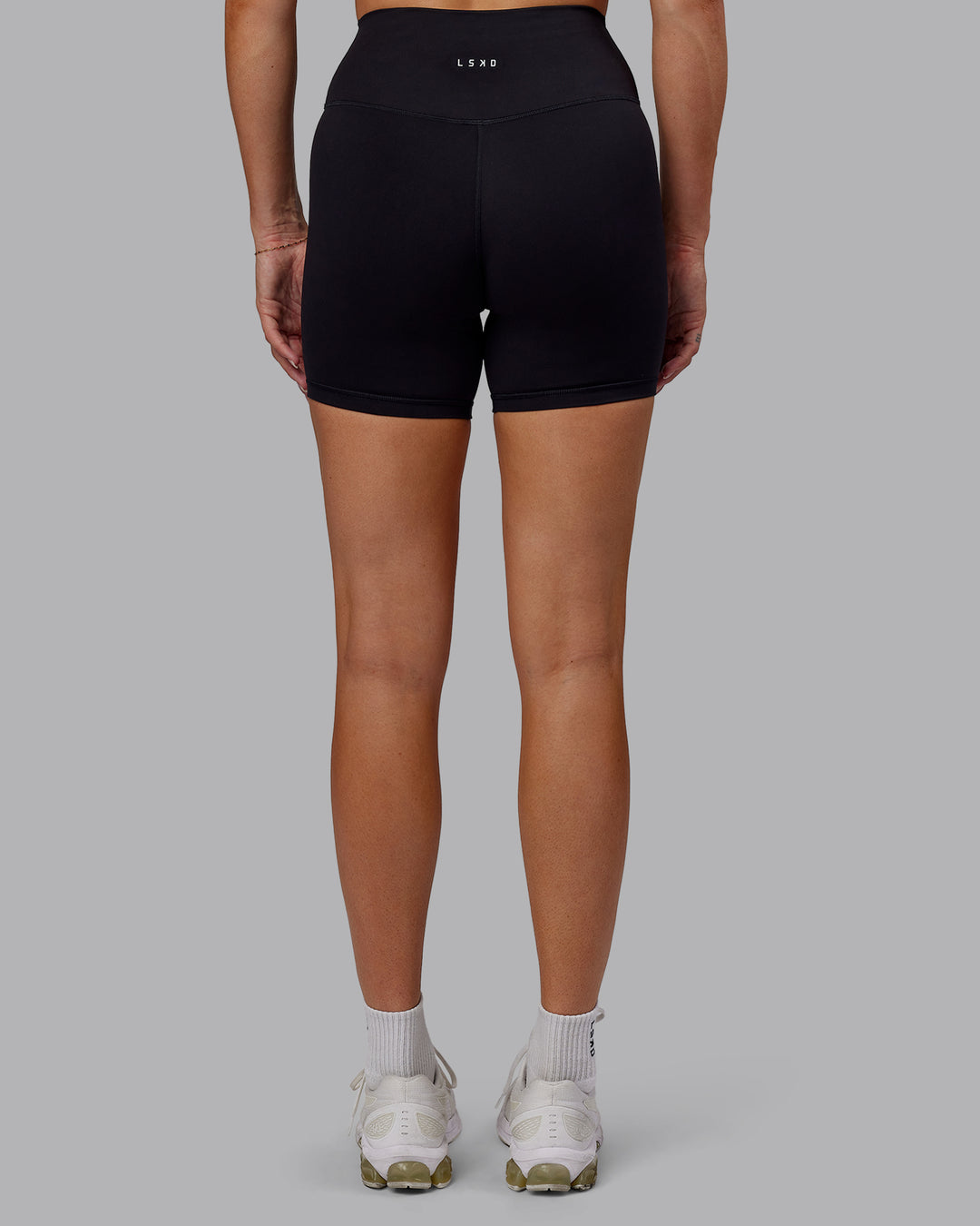 Woman wearing Fusion Ultra High-Rise 6&quot; Short - Black | Model:Hannah | Size:S