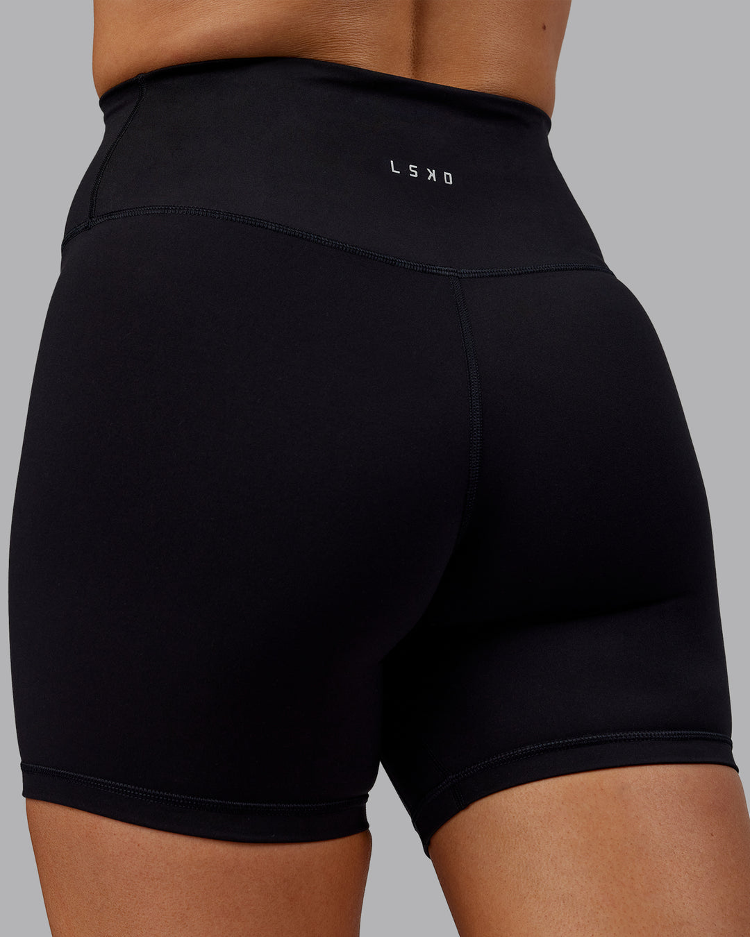 Woman wearing Fusion Ultra High-Rise 6&quot; Short - Black | Model:Hannah | Size:S
