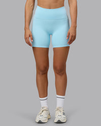 Woman wearing Fusion Ultra High-Rise 6" Short Pockets - Crystal Blue | Set:true | Angle:front | Model:Sophie | Size:S