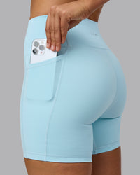 Woman wearing Fusion Ultra High-Rise 6" Short Pockets - Crystal Blue | Set:true | Angle:closeup | Model:Sophie | Size:S