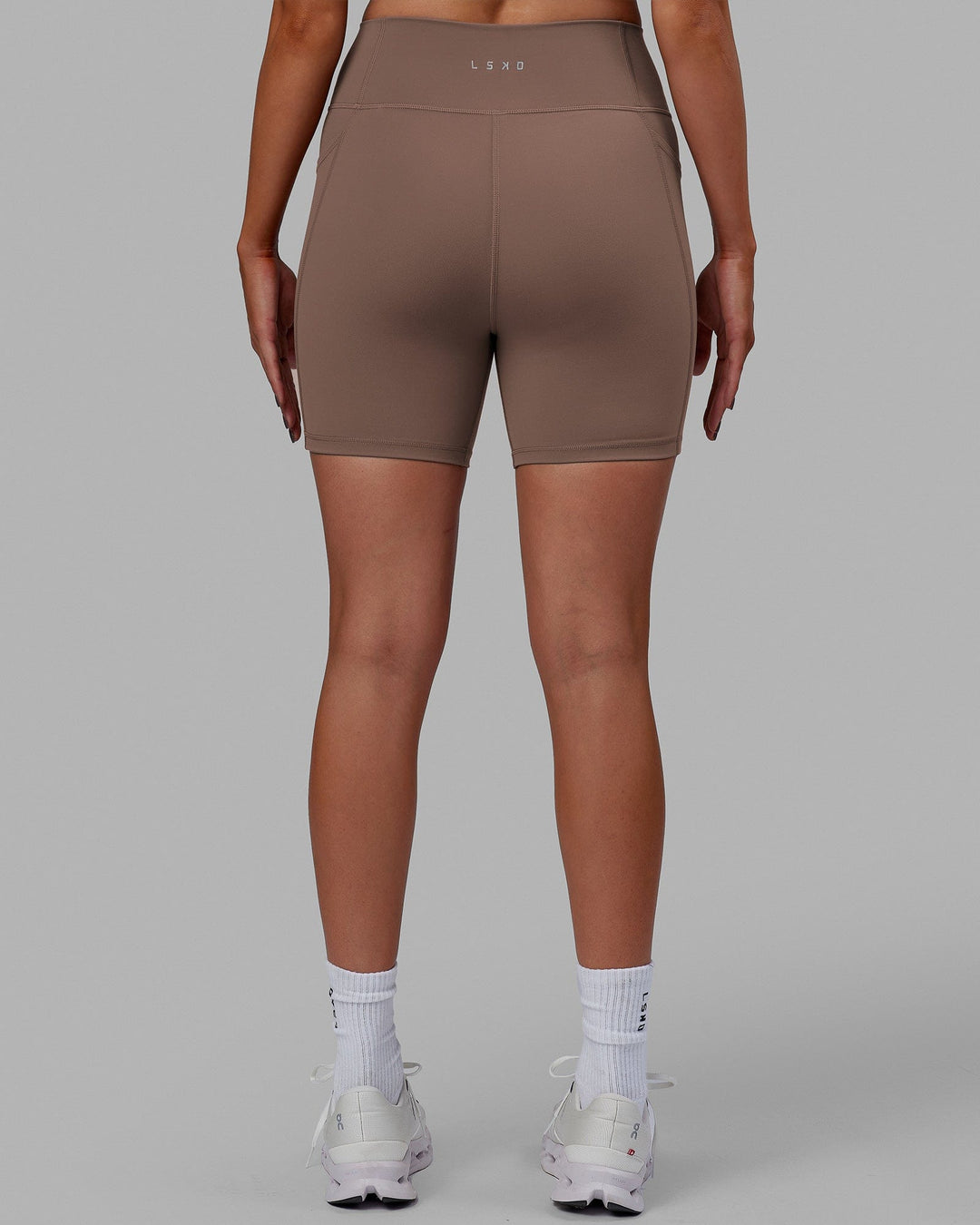 Woman wearing Fusion Mid Short Tight - Deep Taupe