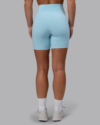 Woman wearing Fusion Ultra High-Rise 6" Short Pockets - Glacial Blue | Model:Monique | Size:S