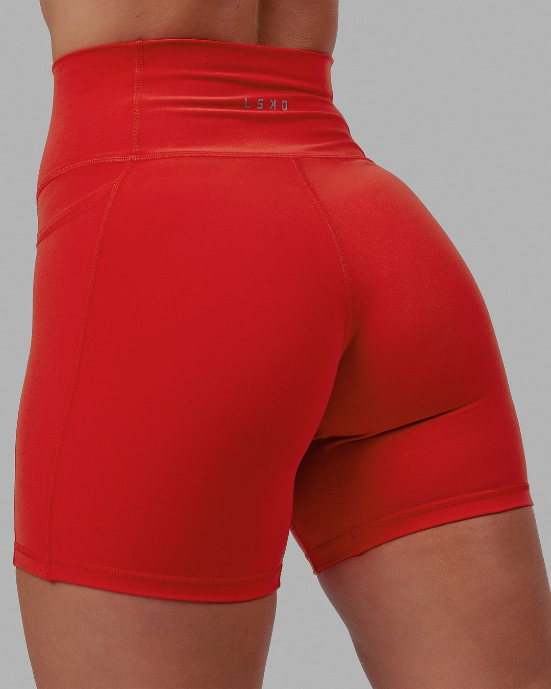 Woman wearing Fusion Mid Short Tights - Infrared