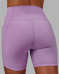 Woman wearing Fusion Ultra High-Rise 6" Short Pockets - Light Violet | Model:Asia | Size:S