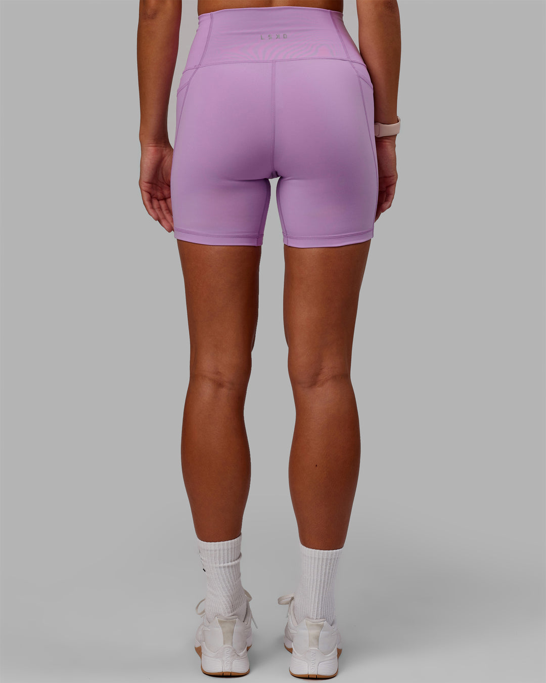 Woman wearing Fusion Ultra High-Rise 6&quot; Short Pockets - Light Violet | Model:Asia | Size:S