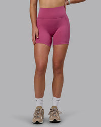 Woman wearing Fusion Ultra High-Rise 6" Short Pockets - Mauve Haze | Model:Chloe | Size:XS