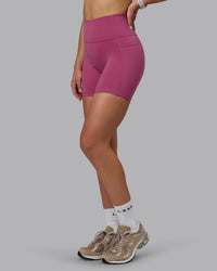 Woman wearing Fusion Ultra High-Rise 6" Short Pockets - Mauve Haze | Model:Chloe | Size:XS