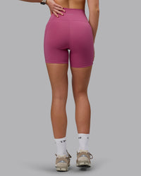 Woman wearing Fusion Ultra High-Rise 6" Short Pockets - Mauve Haze | Model:Chloe | Size:XS
