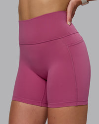 Woman wearing Fusion Ultra High-Rise 6" Short Pockets - Mauve Haze | Model:Chloe | Size:XS