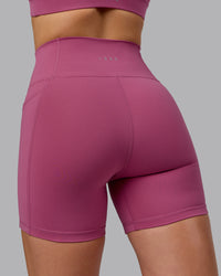 Woman wearing Fusion Ultra High-Rise 6" Short Pockets - Mauve Haze | Model:Chloe | Size:XS