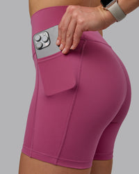 Woman wearing Fusion Ultra High-Rise 6" Short Pockets - Mauve Haze | Model:Chloe | Size:XS