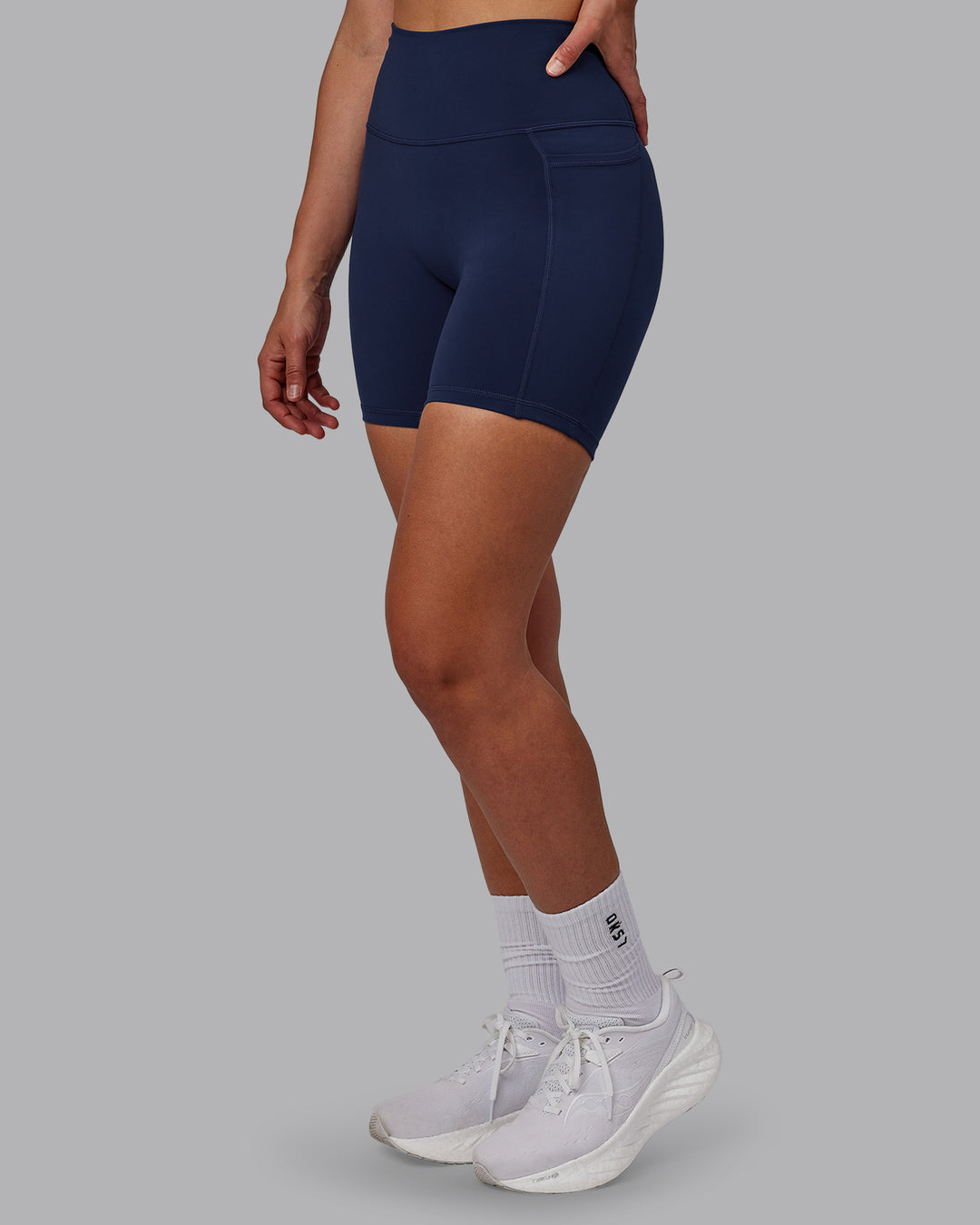 Woman wearing Fusion Ultra High-Rise 6&quot; Short Pockets - Future Navy | Model:Sophie | Size:S