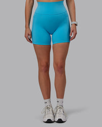 Woman wearing Fusion Ultra High-Rise 6" Short Pockets - Pacific Blue | Model:Lillie | Size:S