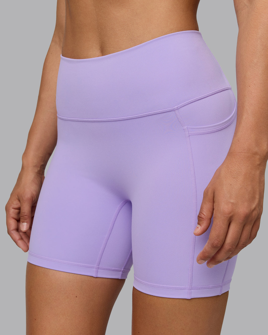 Woman wearing Fusion Ultra High-Rise 6&quot; Short Pockets - Pale Lilac | Model:Sophie | Size:S