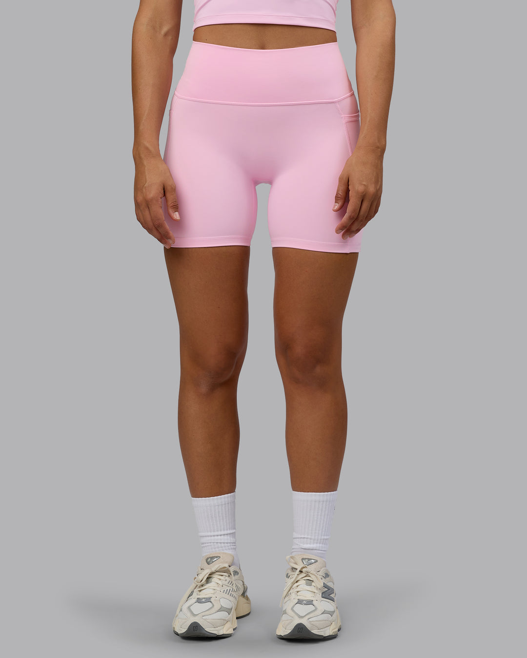 Woman wearing Fusion Ultra High-Rise 6&quot; Short Pockets - Pale Pink | Model:Sophie | Size:S