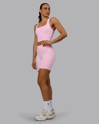 Woman wearing Fusion Ultra High-Rise 6" Short Pockets - Pale Pink | Model:Sophie | Size:S