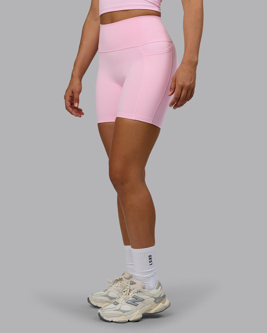 Woman wearing Fusion Ultra High-Rise 6&quot; Short Pockets - Pale Pink | Model:Sophie | Size:S