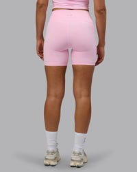 Woman wearing Fusion Ultra High-Rise 6" Short Pockets - Pale Pink | Model:Sophie | Size:S