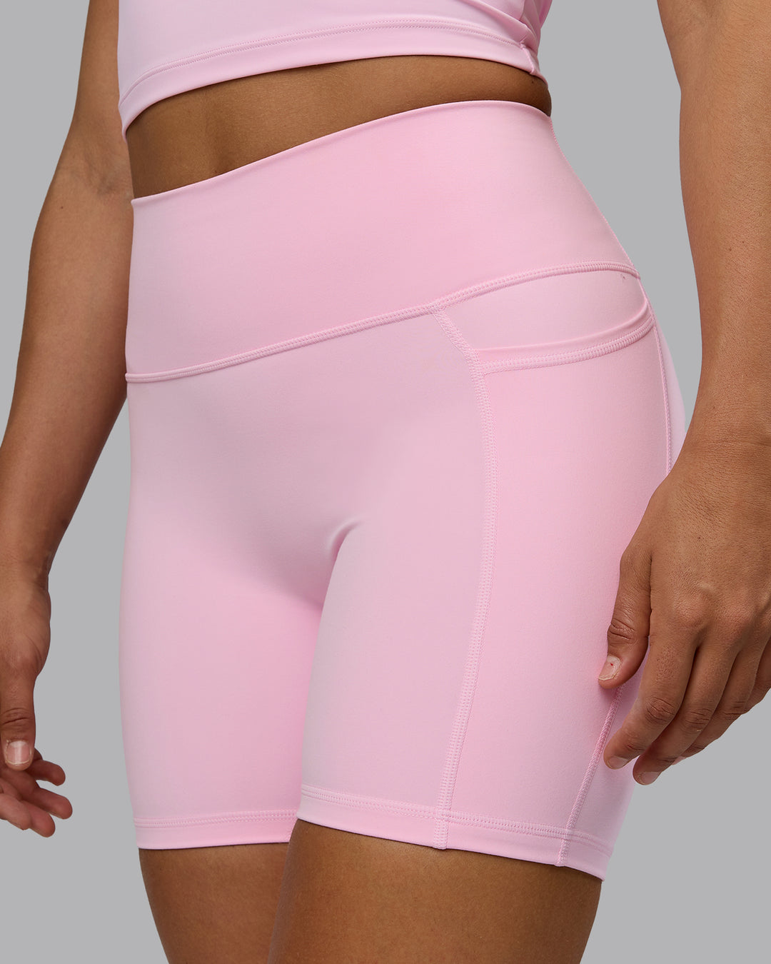 Woman wearing Fusion Ultra High-Rise 6&quot; Short Pockets - Pale Pink | Model:Sophie | Size:S