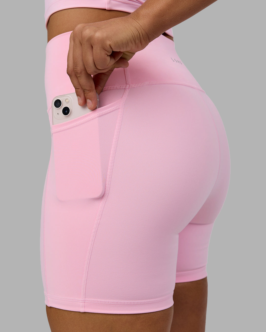 Woman wearing Fusion Ultra High-Rise 6&quot; Short Pockets - Pale Pink | Model:Sophie | Size:S