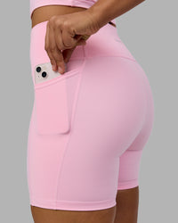 Woman wearing Fusion Ultra High-Rise 6" Short Pockets - Pale Pink | Model:Sophie | Size:S