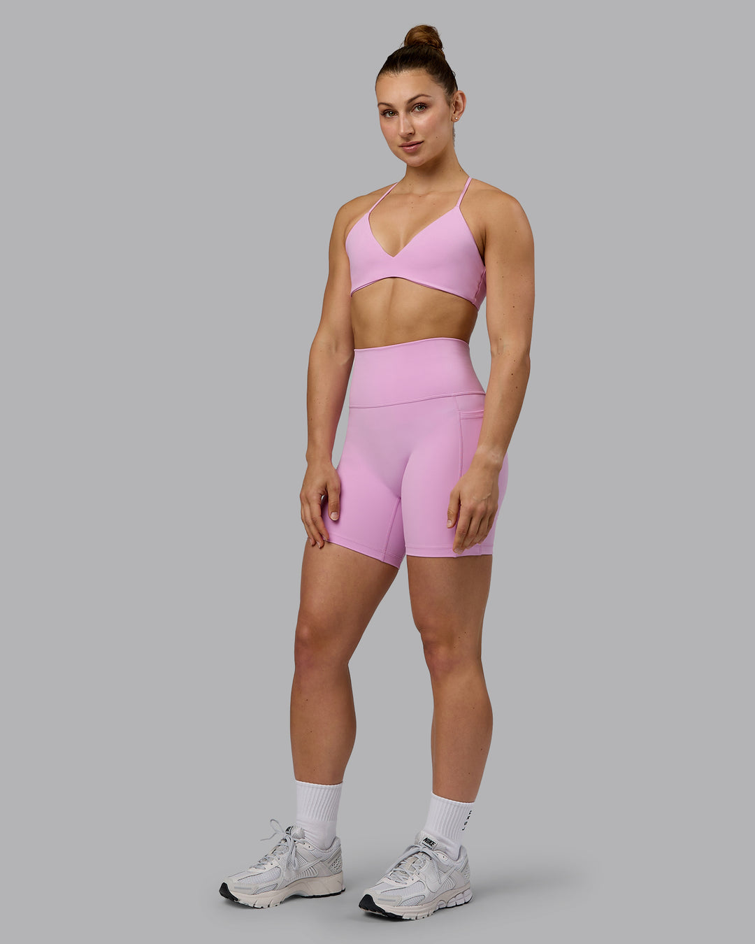 Woman wearing Fusion Ultra High-Rise 6&quot; Short Pockets - Pastel Orchid | Model:Zoe | Size:S