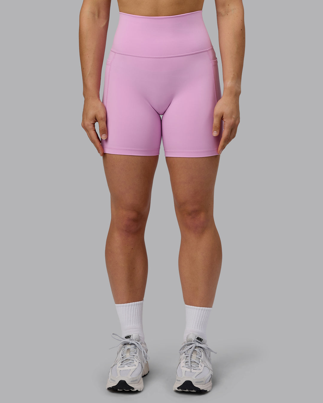 Woman wearing Fusion Ultra High-Rise 6&quot; Short Pockets - Pastel Orchid | Model:Zoe | Size:S
