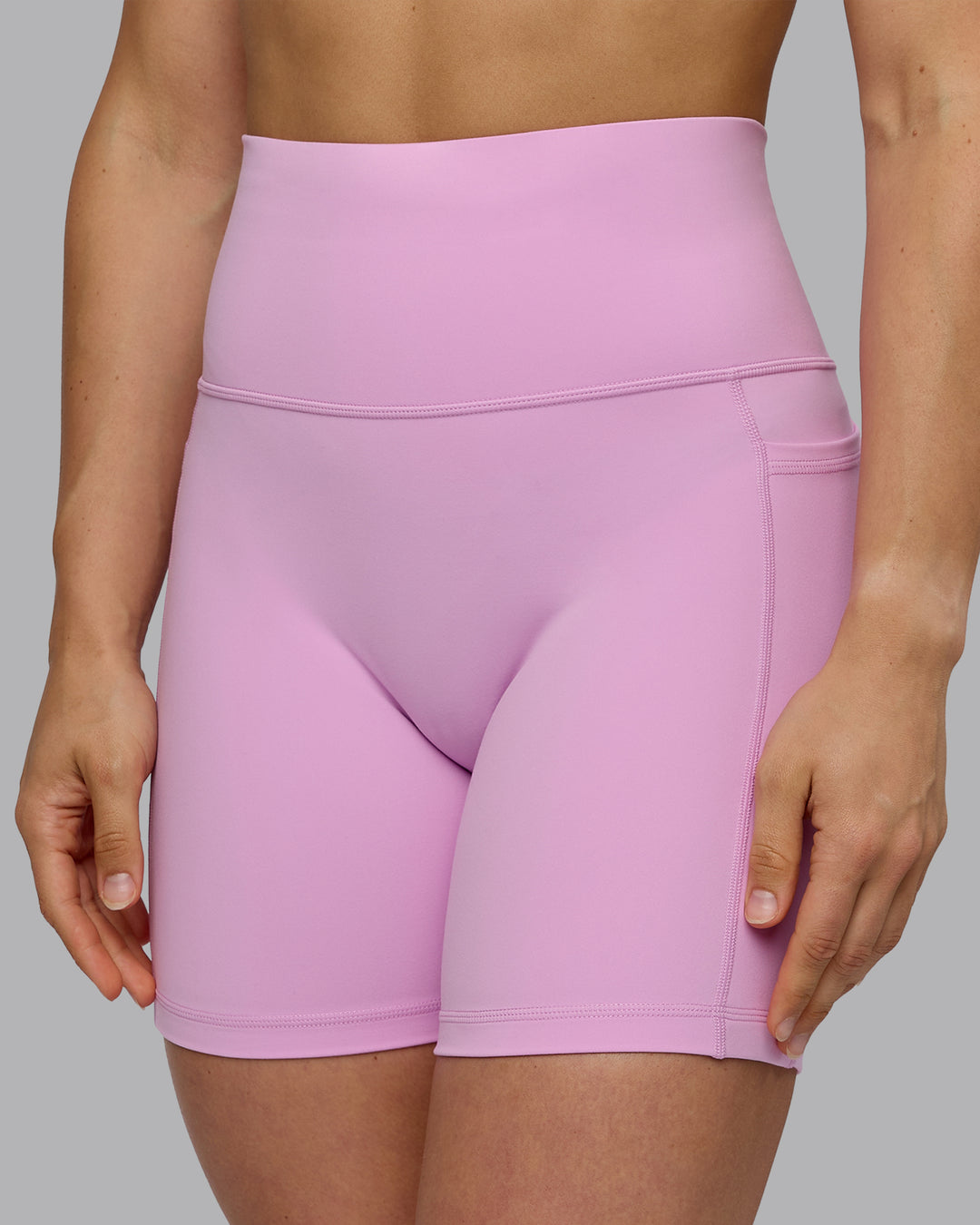Woman wearing Fusion Ultra High-Rise 6&quot; Short Pockets - Pastel Orchid | Model:Zoe | Size:S