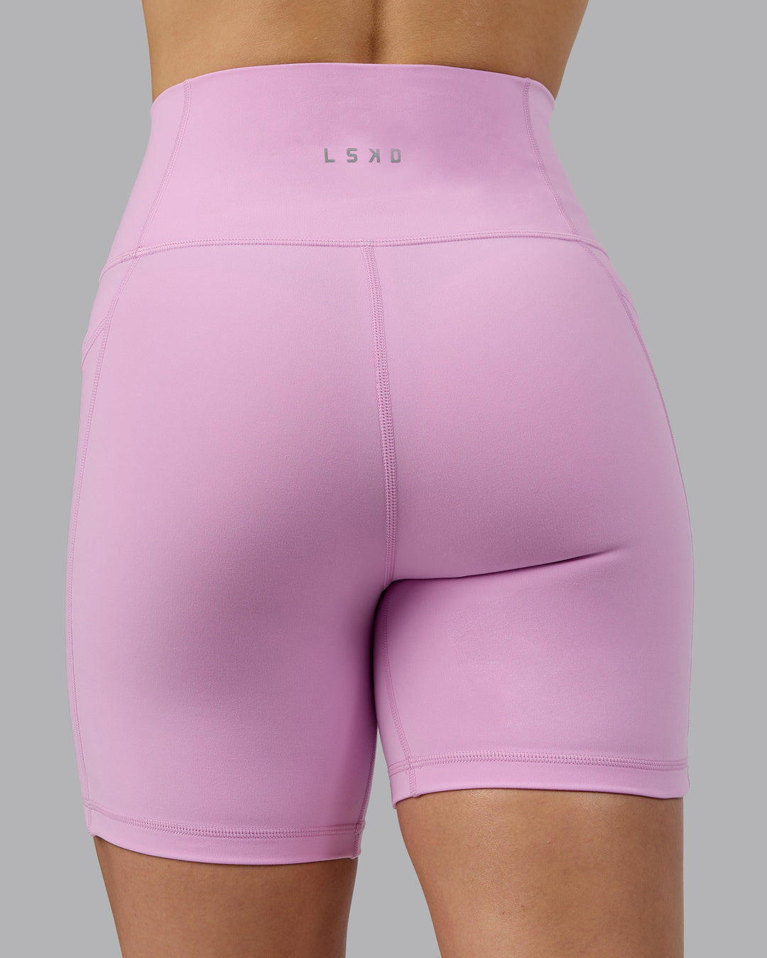 Woman wearing Fusion Ultra High-Rise 6&quot; Short Pockets - Pastel Orchid | Model:Zoe | Size:S
