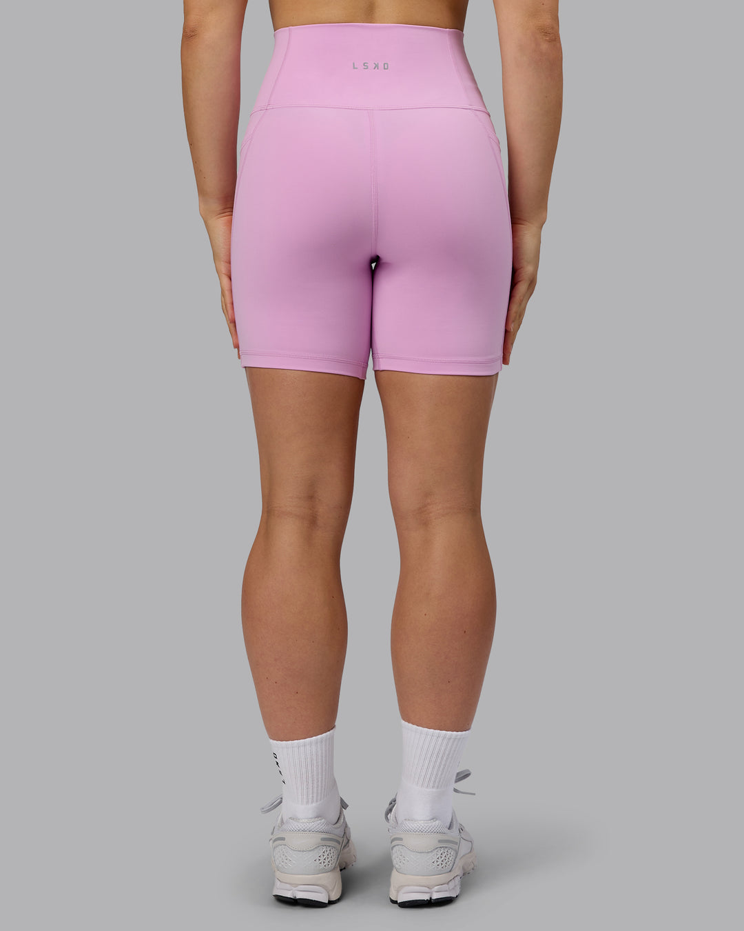 Woman wearing Fusion Ultra High-Rise 6&quot; Short Pockets - Pastel Orchid | Model:Zoe | Size:S