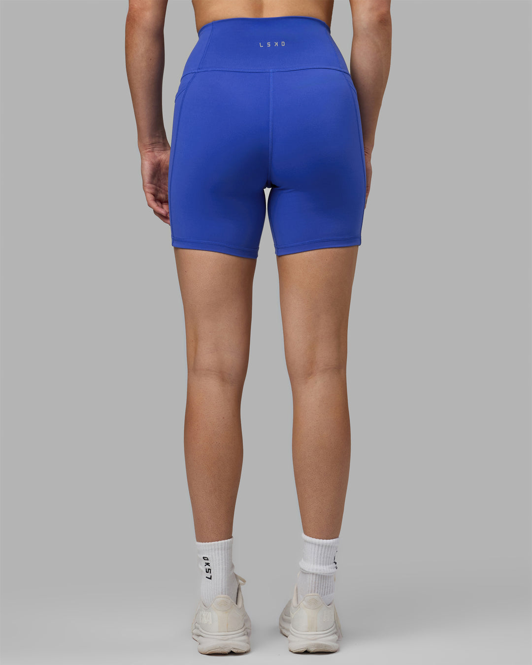 Woman wearing Fusion Ultra High-Rise 6&quot; Short Pockets - Power Cobalt | Model:Hannah | Size:S