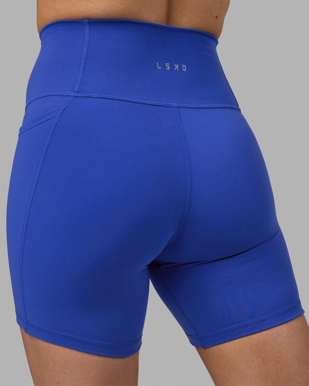 Woman wearing Fusion Ultra High-Rise 6&quot; Short Pockets - Power Cobalt | Model:Hannah | Size:S