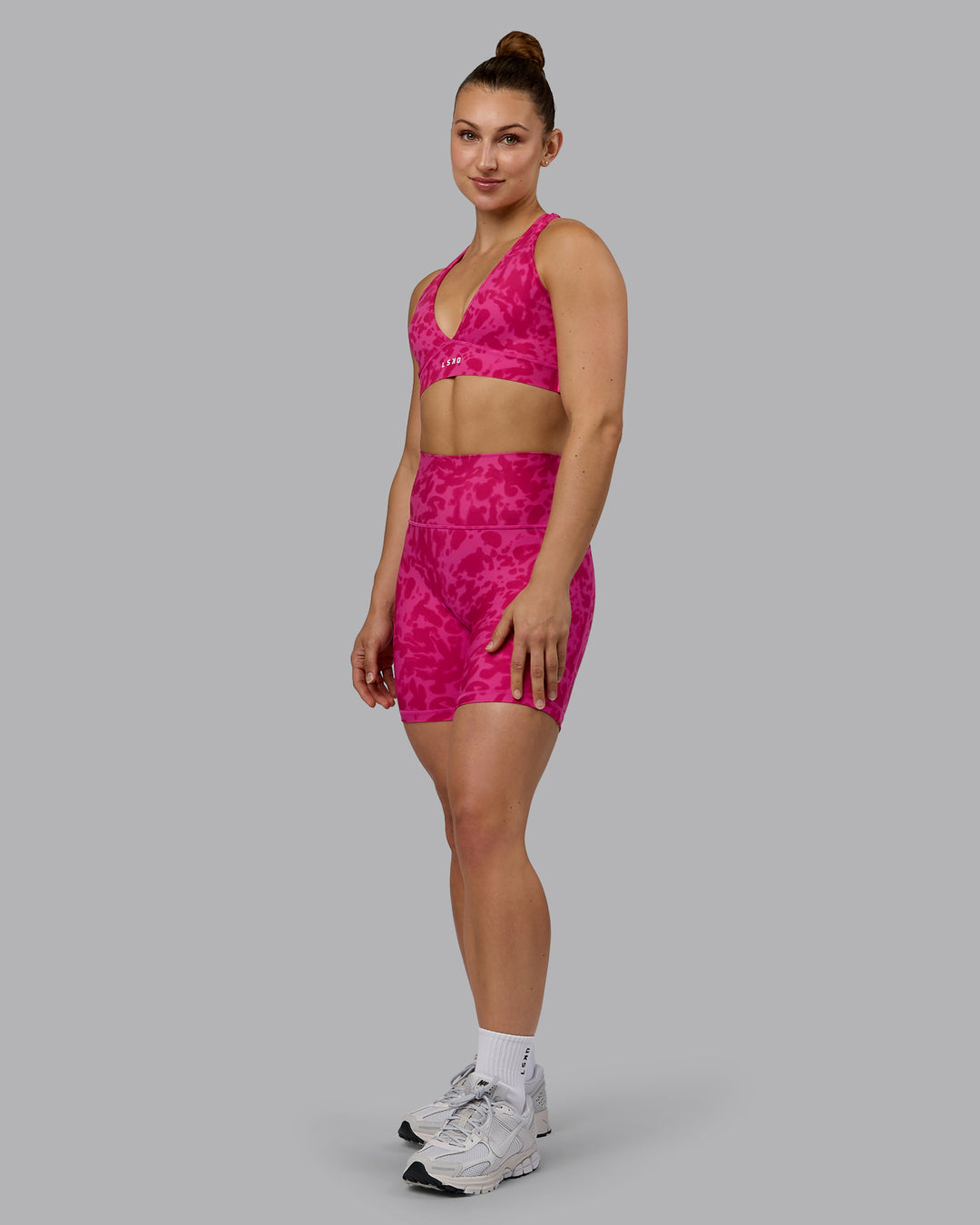Woman wearing Fusion Ultra High-Rise 6&quot; Short Pockets - Strawberry-Lava Lamp | Model:Zoe | Size:S