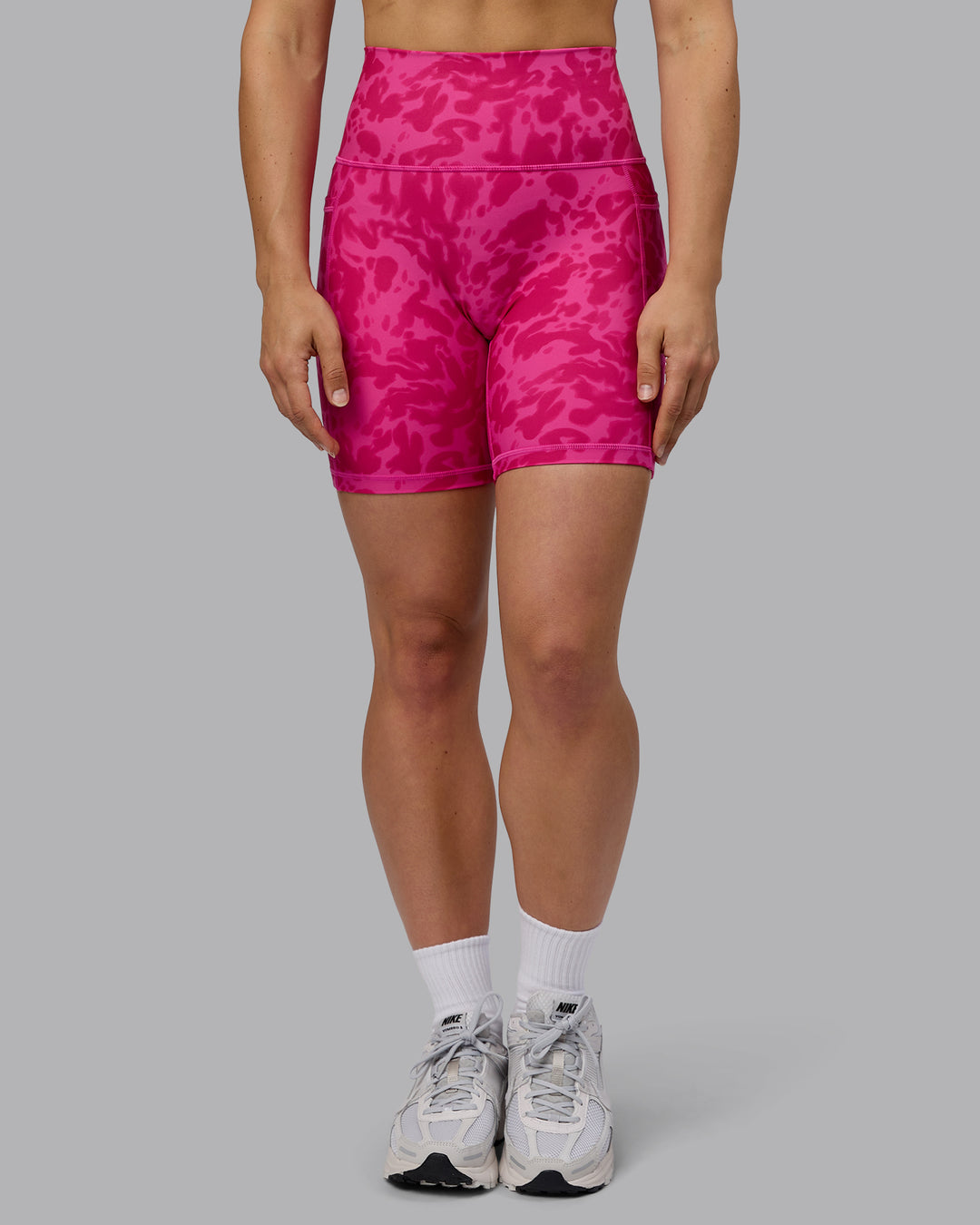 Woman wearing Fusion Ultra High-Rise 6&quot; Short Pockets - Strawberry-Lava Lamp | Model:Zoe | Size:S