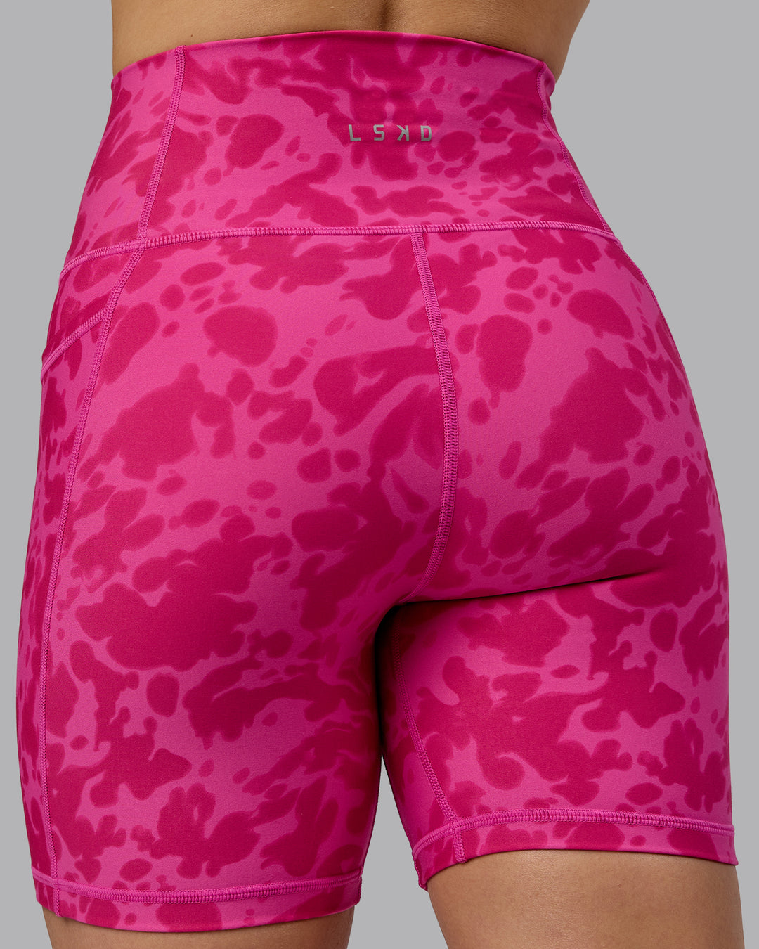 Woman wearing Fusion Ultra High-Rise 6&quot; Short Pockets - Strawberry-Lava Lamp | Model:Zoe | Size:S
