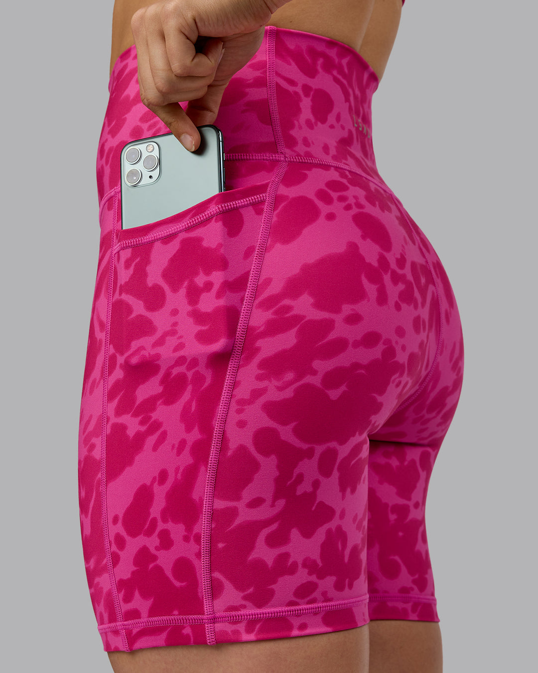 Woman wearing Fusion Ultra High-Rise 6&quot; Short Pockets - Strawberry-Lava Lamp | Model:Zoe | Size:S