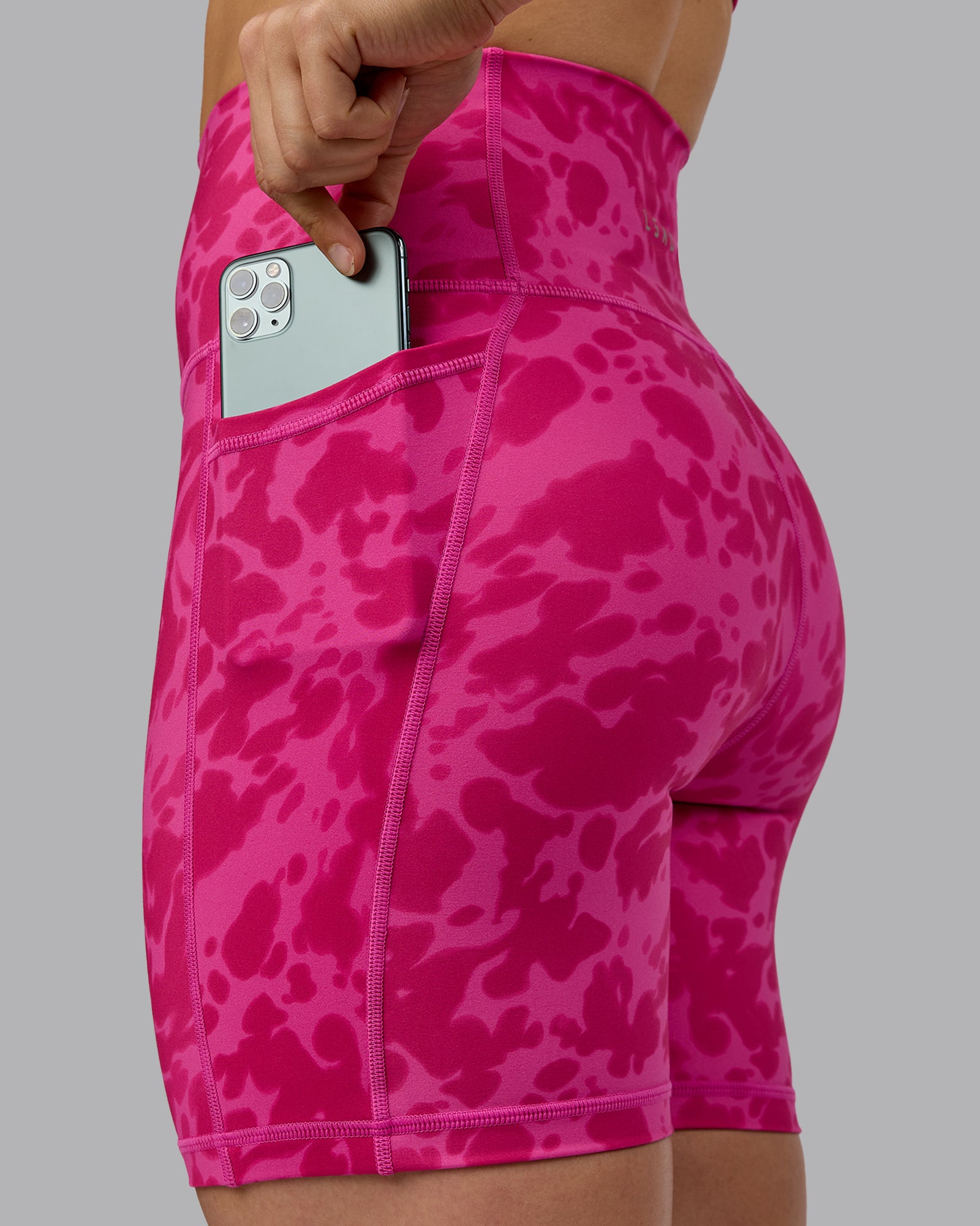 Woman wearing Fusion Ultra High-Rise 6" Short Pockets - Strawberry-Lava Lamp | Model:Zoe | Size:S