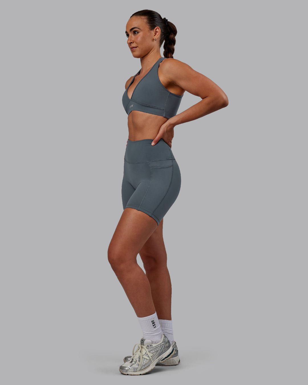 Woman wearing Fusion Ultra High-Rise 6&quot; Short Pockets - Turbulence | Model:Sophie | Size:S