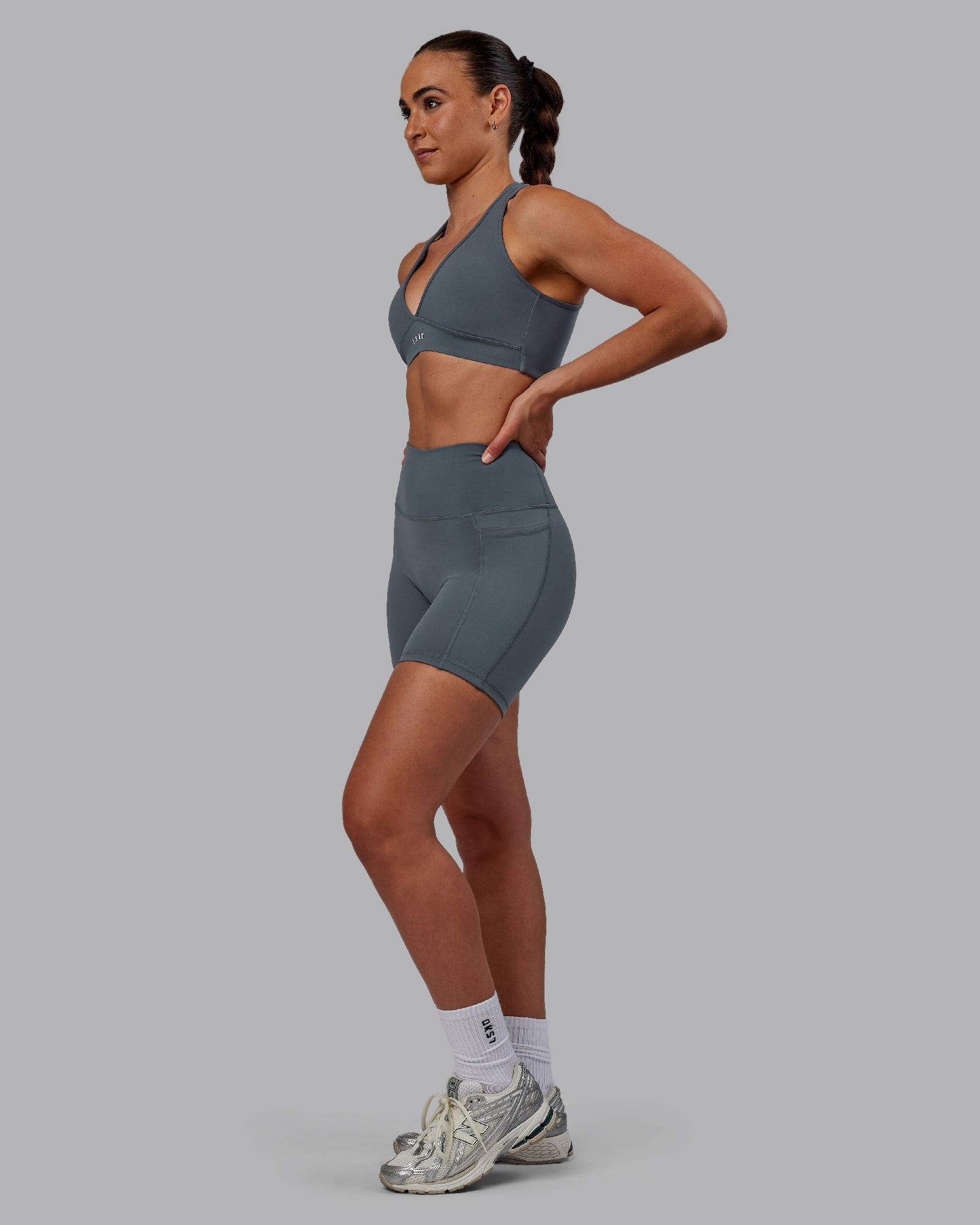 Woman wearing Fusion Ultra High-Rise 6" Short Pockets - Turbulence | Model:Sophie | Size:S