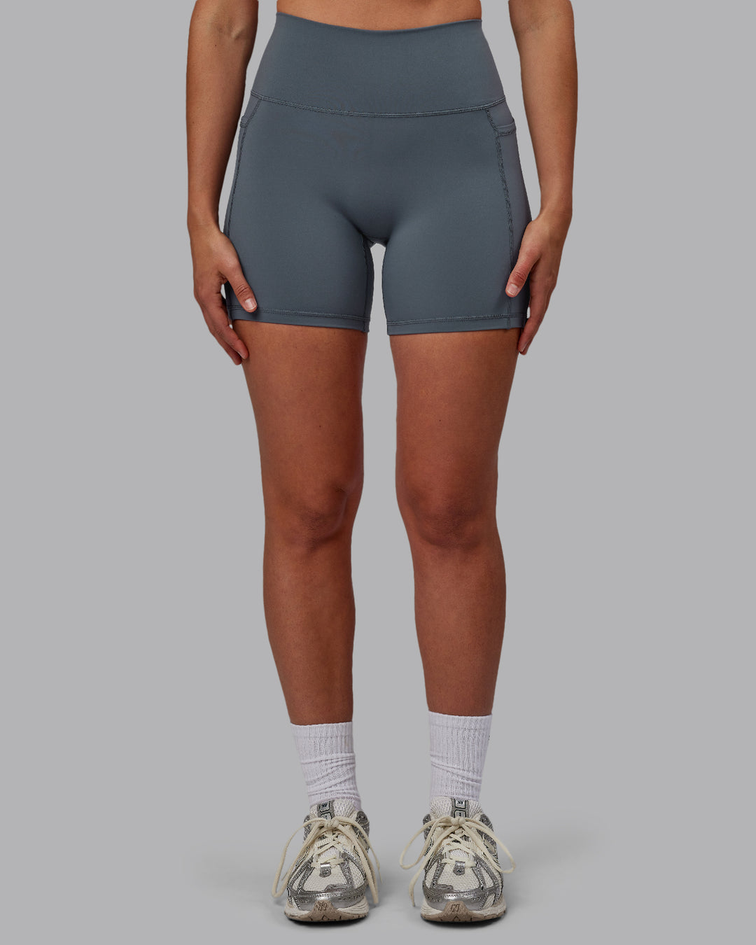 Woman wearing Fusion Ultra High-Rise 6&quot; Short Pockets - Turbulence | Model:Sophie | Size:S