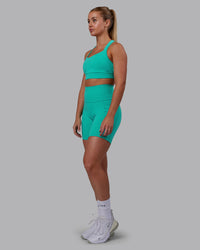 Woman wearing Fusion Ultra High-Rise 6" Short Pockets - Turquoise Tide | Model:Hannah | Size:S