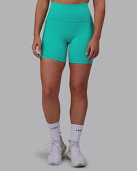 Woman wearing Fusion Ultra High-Rise 6" Short Pockets - Turquoise Tide | Model:Hannah | Size:S