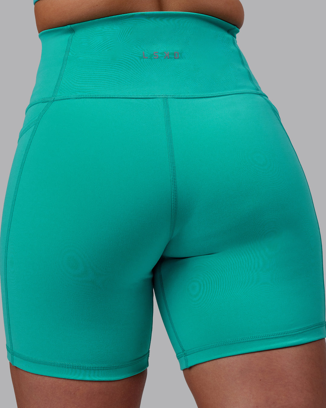 Woman wearing Fusion Ultra High-Rise 6" Short Pockets - Turquoise Tide | Model:Hannah | Size:S