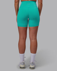 Woman wearing Fusion Ultra High-Rise 6" Short Pockets - Turquoise Tide | Model:Hannah | Size:S